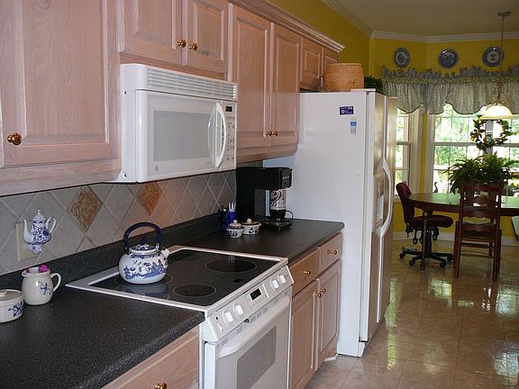 Large kitchen is adjacent to breakfast area.