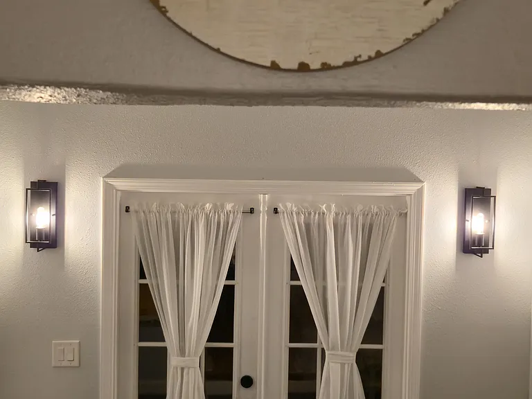 french doors and doggie door leads to backyard