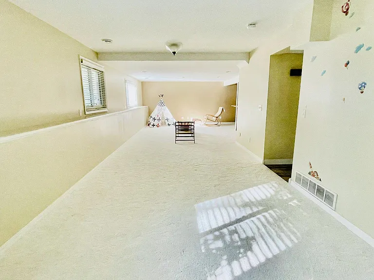 Complete Basement Entertaining Area view. The entire basement is at 900+ sqft thus could easily be used as additional office/entertaining/bedroom.