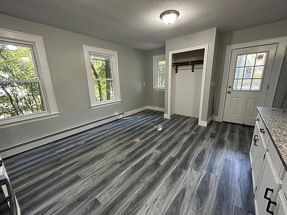 Kitchen with granite counters, stainless appliances, black hardware, black faucet, etc.