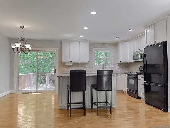 Kitchen view from top of stairs.