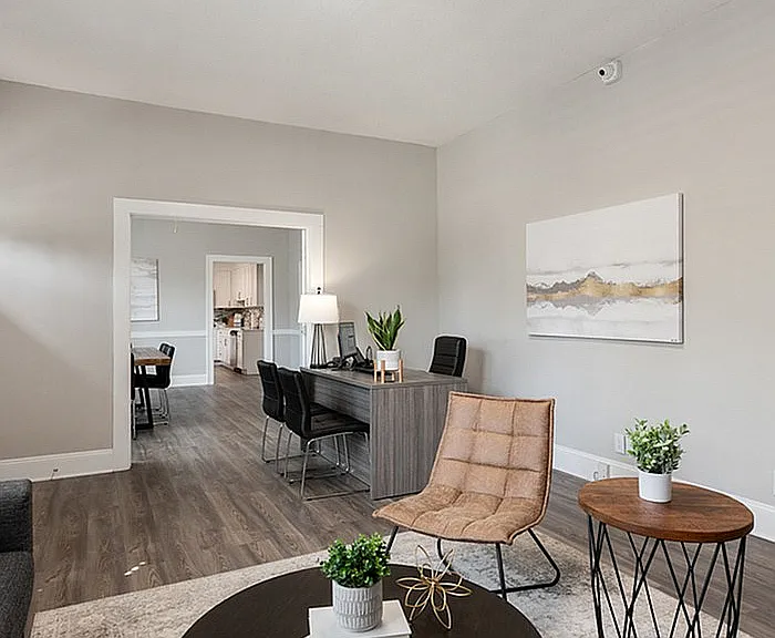 Explore this sophisticated living room designed for comfort and style, perfect for both work and relaxation.