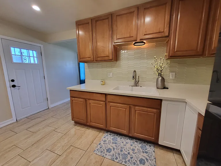 Open, roomy kitchen with plenty of cabinets and two lazy-susans: One has two shelf pie-cut polymer, the second two shelfs