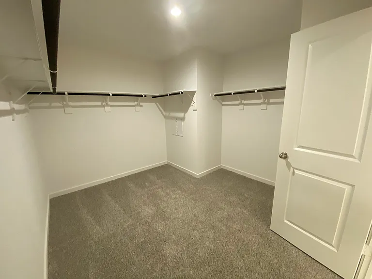 Large walk-in closet in master bedroom