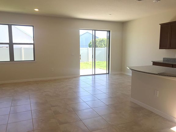 Open plan kitchen/dining/living area.