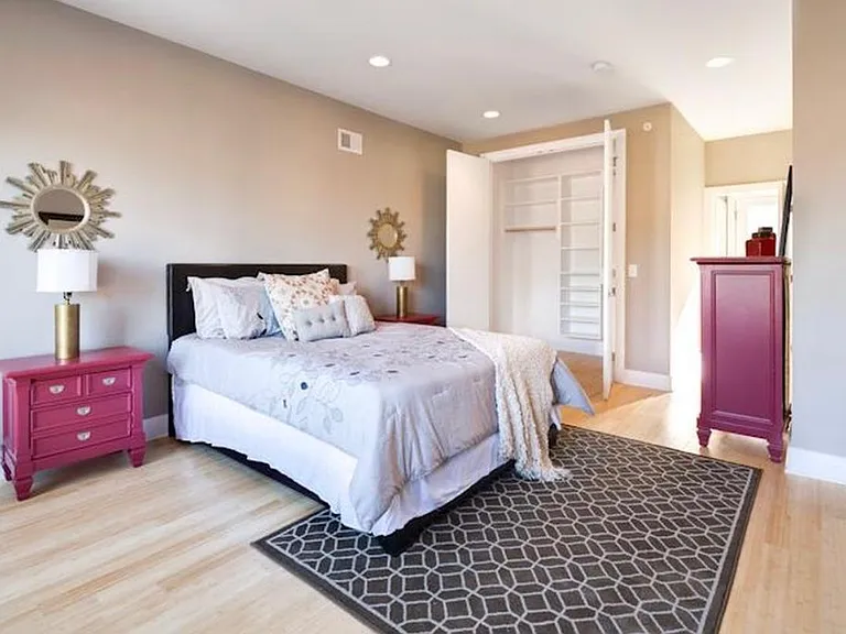 Main bedroom with ample natural light and walk-in closet