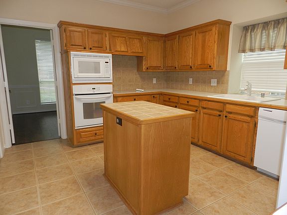Isle in the Kitchen with Plenty of Cabinet Space