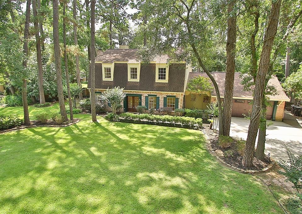 Fabulous street appeal. Estate living in the trees yet close-in Cypress.