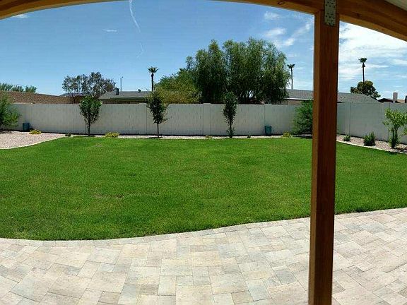 Large, private backyard w/RV gate. Plenty of grass for playing and large patio for hanging out! Trees are much bigger now and monthly mowing and tree trimming is included with the rent.