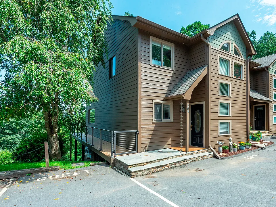 Charming mountain townhome exterior with private entrance and guest parking.