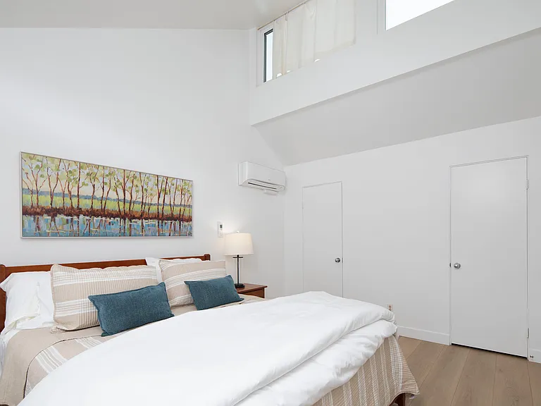 Primary bedroom is located upstairs. King size bed, walk in closet, en suite bathroom