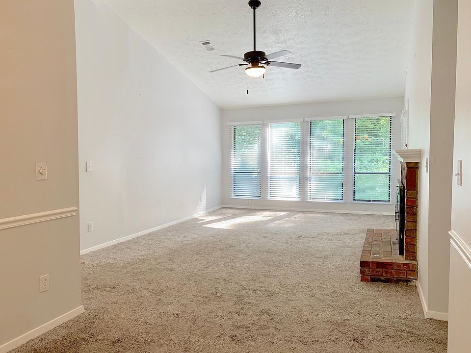 The main living space boasts soaring cathedral ceiling.