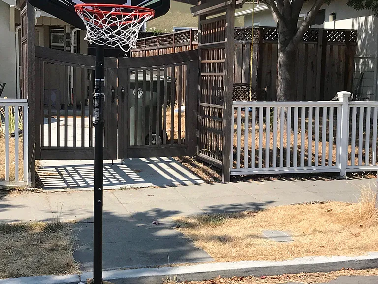 Street view of home. Small child's basketball hoop belongs t