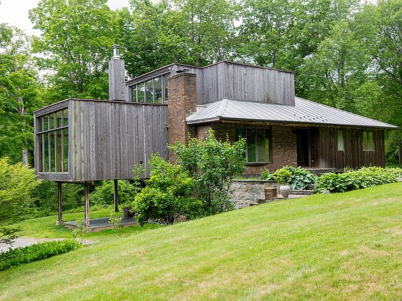 Side of house/patio reached from kitchen.