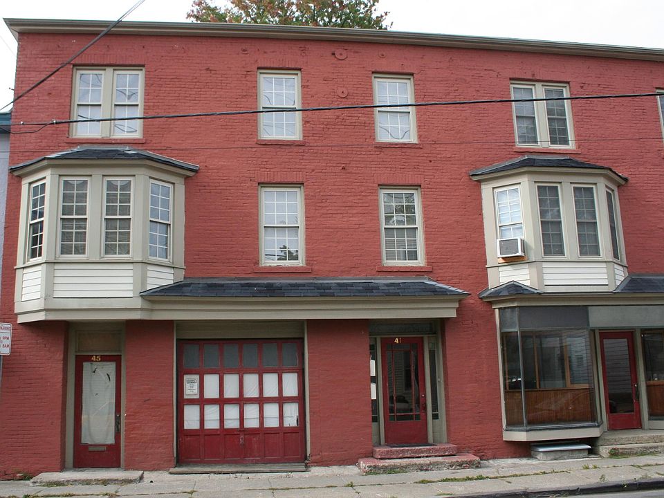 Apt entrance is 2nd door from left, the apt is a duplex above the 3 sidewalk doors