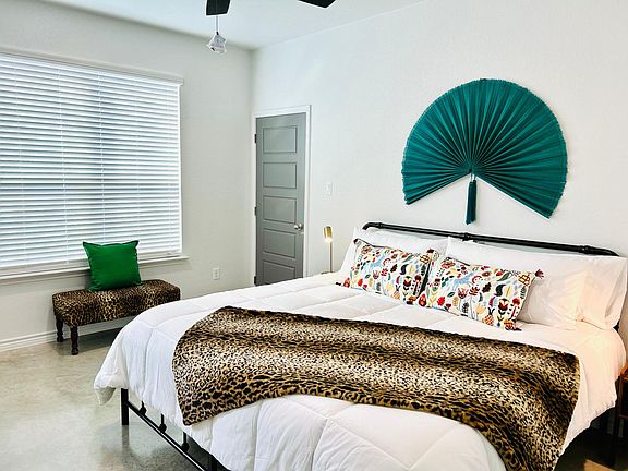 Master bedroom with king bed. Door leads to large walk in closet.