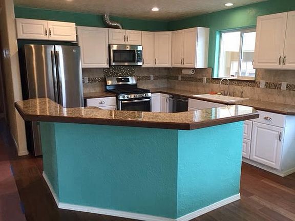 Kitchen.  Granite Countertops, island with storage cabinets.