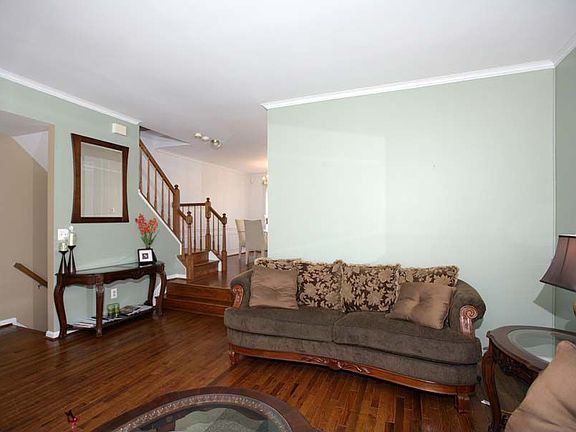 LIVING ROOM FEATURES WOOD FLOORS