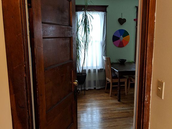 Inner front door opens on dining/common space.