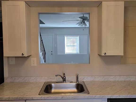 Light, bright kitchen with new cabinets, new countertops, new fixtures and appliances.