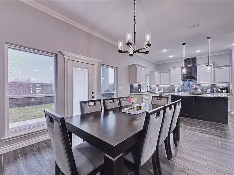 Bright dining area conveniently situated adjacent to the kitchen.