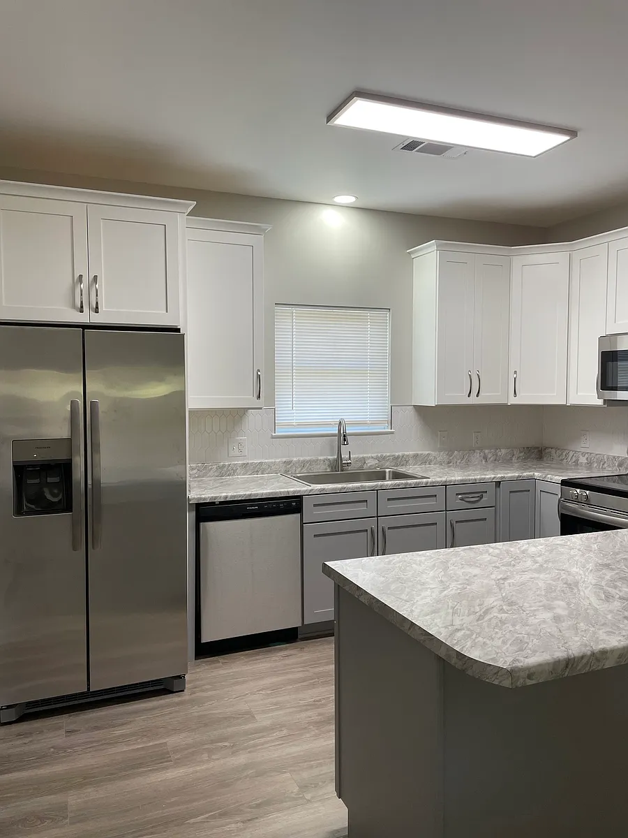 Kitchen with lots of cabinets, dishwasher, refrigerator, smooth top stove and built in microwave. - Coosa County Road 76