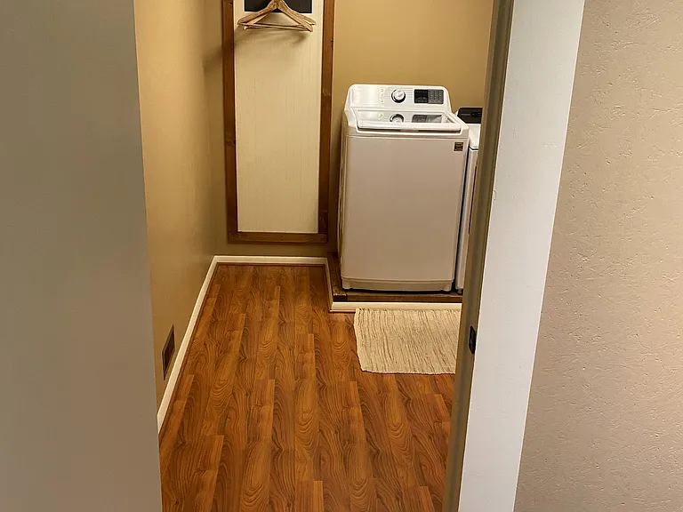 (1 of 3) Half bath/Laundry looking from the rear entry/mud room.