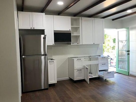 There is now a new oven, farm house sink and butcher block counter top. Beautiful!