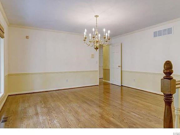 Formal Dining room with Bay Window and refinished wood floors.