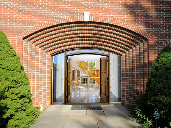 Magnificent Entry leads to the Grand Foyer beyond. The magical staircase is highlighted in the background.