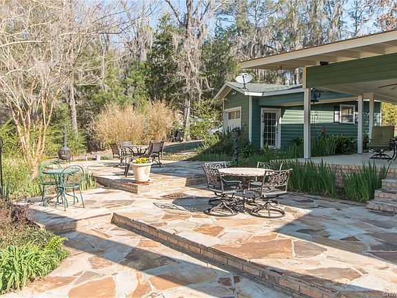 The flagstone patio with all the different levels of interest allows for entertaining large groups or intimate gatherings. Since this photo was just taken more landscaping additions along with more flagstone accents. Must see in person.