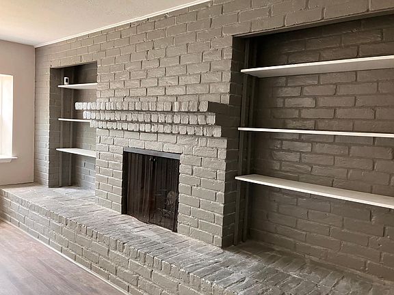 Working fireplace with built in shelves.