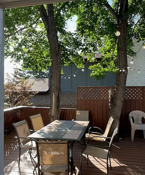 Side view of large, porch table great for summer and fall and spring dinners and cookouts.
