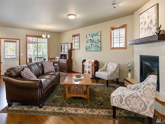 Open concept living at it's finest. The gas fireplace creates a focal point accented by a wood mantle and real wood trim. 