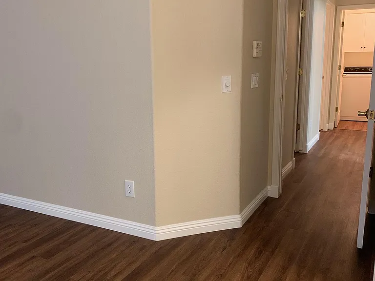 New luxury vinyl plank flooring, baseboards and paint.
