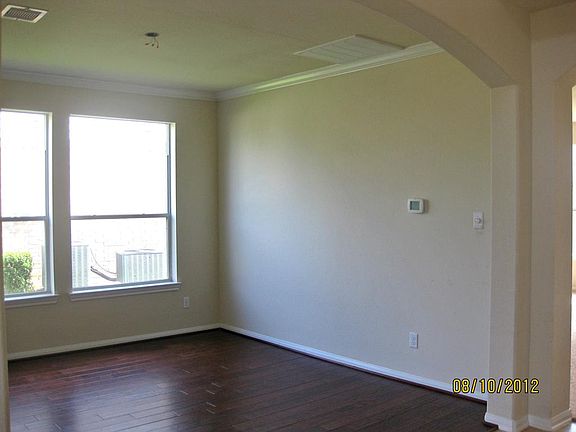 Formal Dining Room has wide plank wood floors