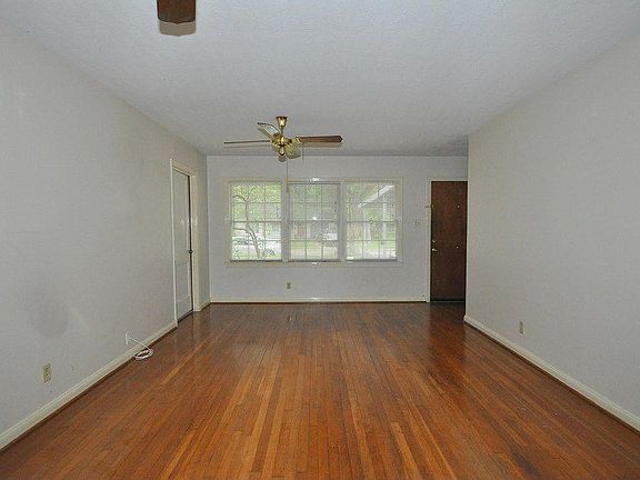 Large living and dining area with hutches
