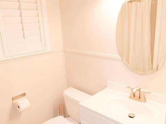 Shared bathroom with shower.