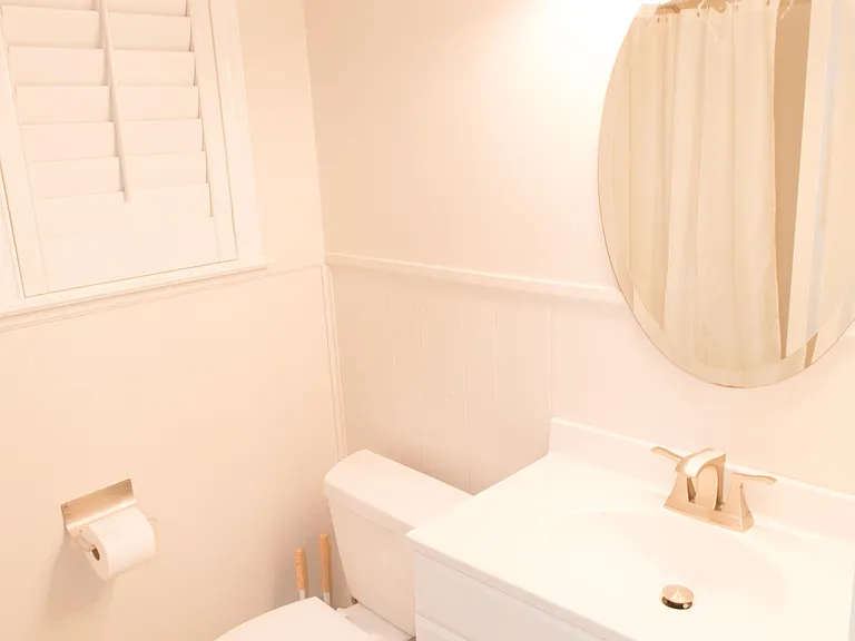 Shared bathroom with shower.