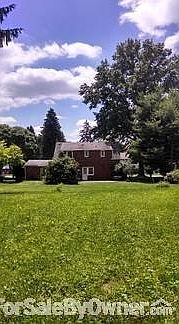 Lovely large backyard
						:
						yard offers heirloom flowers, roses, mature hosta & bulbs