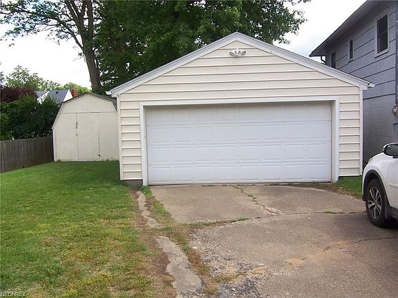 2 car garage with opener.  Large storage building.