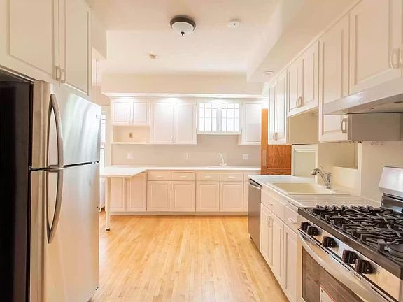 Open kitchen with gas stove and ample storage