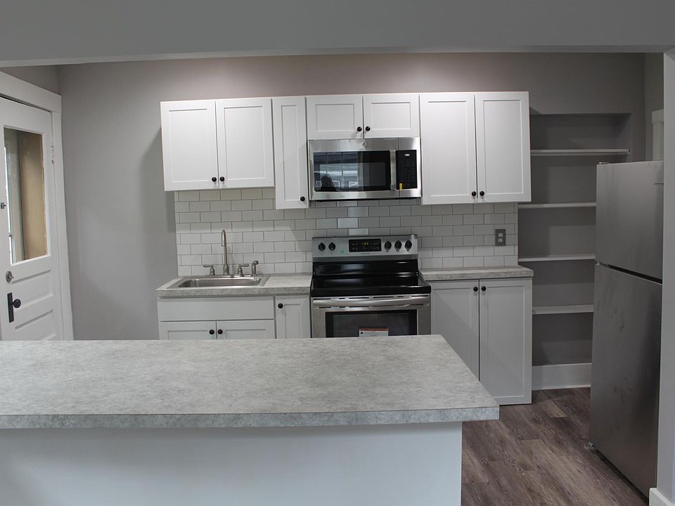View of bar and kitchen from dining area