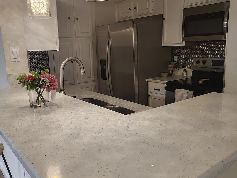 Beautiful kitchen with New Counters and New programing light fixtures!