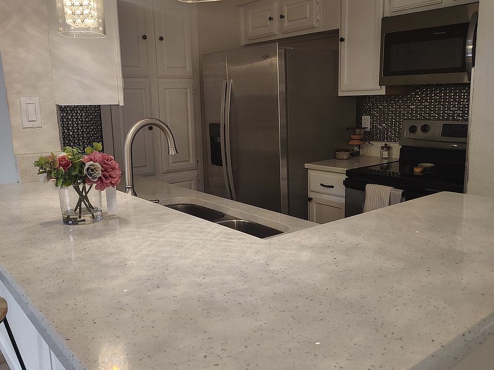 Beautiful kitchen with New Counters and New programing light fixtures!