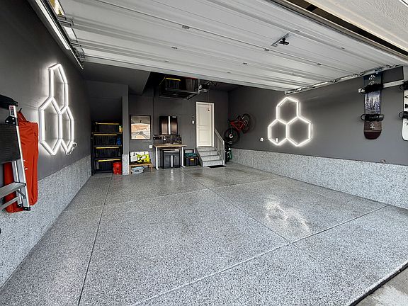 Professionally finished garage with overhead storage