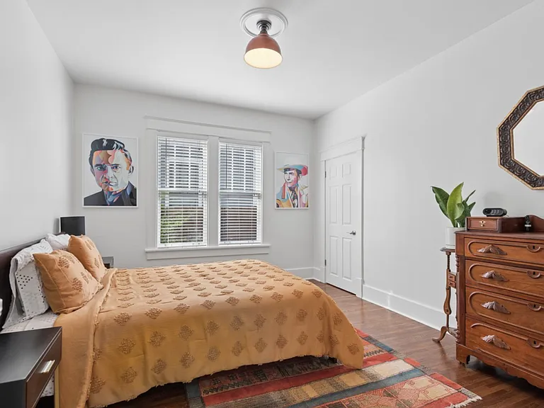 Designed for rest and recharge, this comfortable bedroom combines timeless character with easy access to the downstairs full bath.