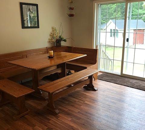 Dining area w view towards back yard and shed