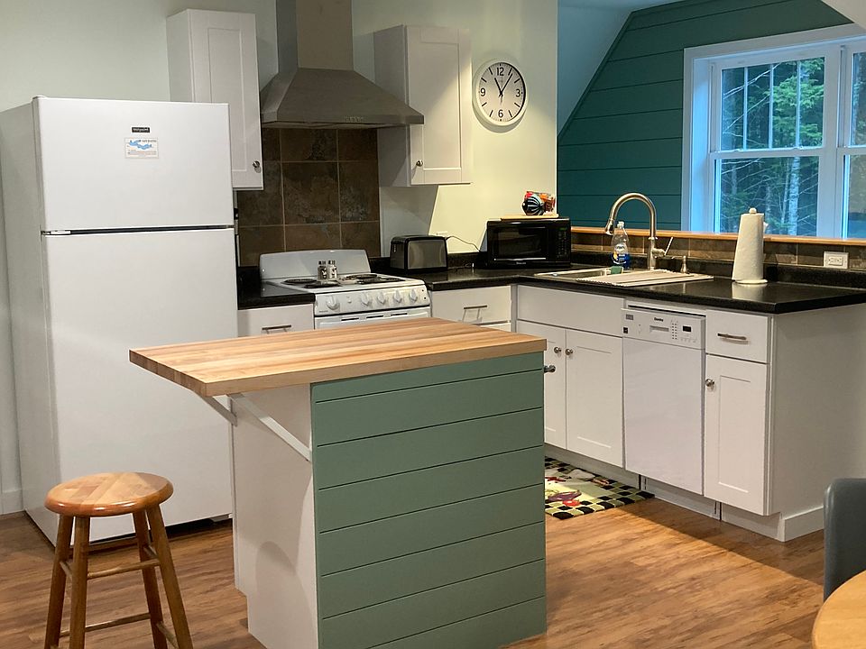 kitchen complete with dishwasher and island