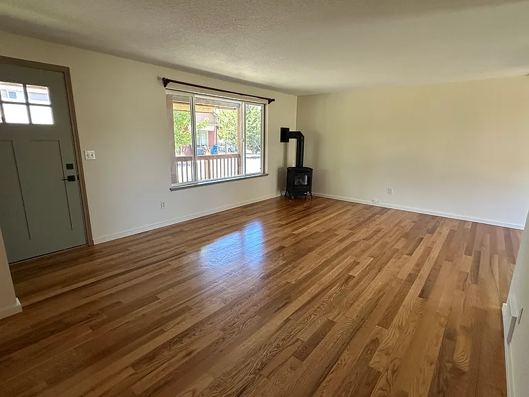 Home is completely floored with real, 3/4" hardwood (primarily oak) and tile (laundry, kitchen and bathroom).
